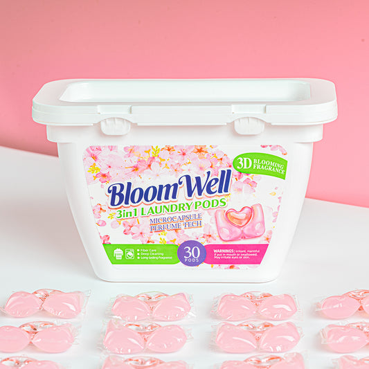 Closed 30-count tub of Heart Pod laundry pods in Floral Peach with pods arranged in front