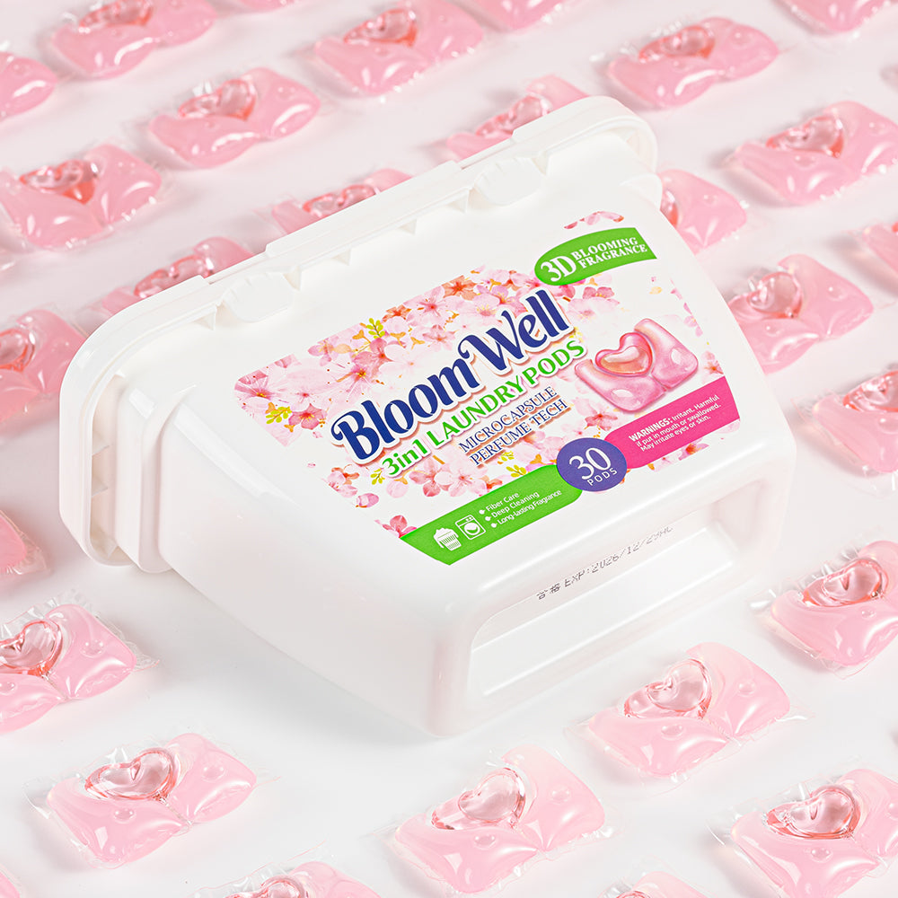 Angled view of the Heart Pod Floral Peach tub resting on a bed of pink heart-shaped pods