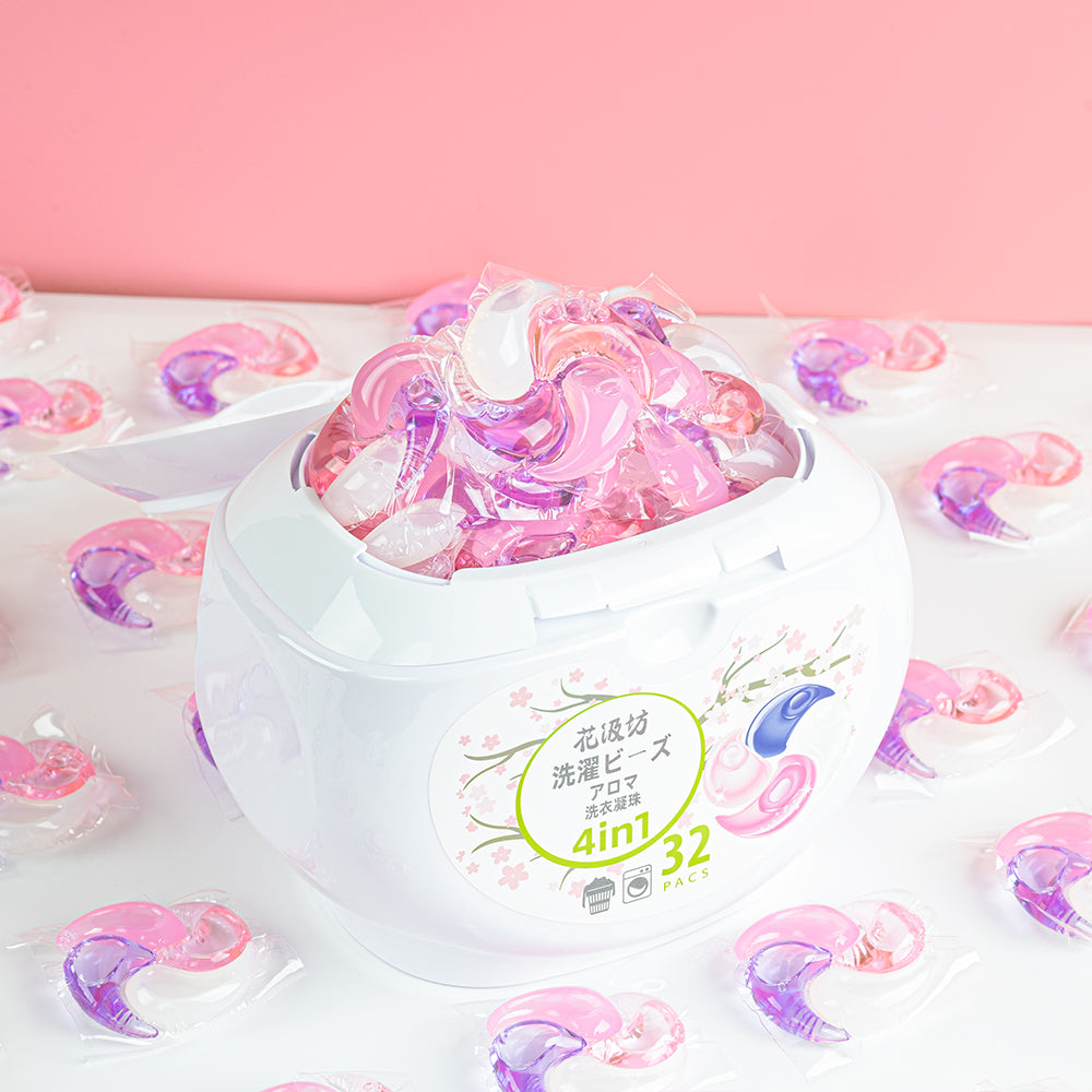 Sakura Blossom Swirl Pod laundry pod tub with the lid open and pods arranged in front